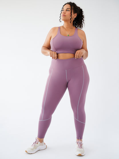 Legging écoresponsable couleur Grape, vue de face, avec taille haute et découpes flatteuses.