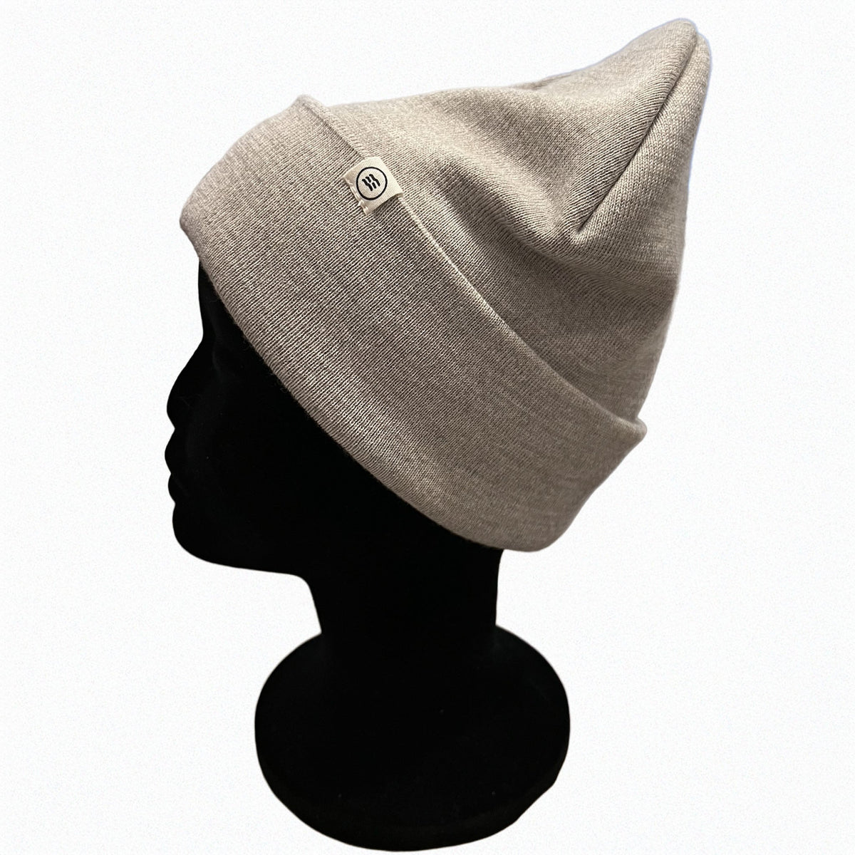 Tuque en Mérino Sand avec clip label discret
